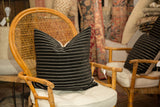 Soft black chenille velvet pillow featuring fine white horizontal stripes.