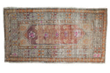 Distressed vintage Oushak runner, worn tree of life pattern in plum, cochineal, and ivory tones.