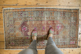 Distressed vintage Oushak runner with faded plum, cochineal, and visible tree-of-life motif.