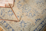 Distressed texture of vintage Oushak rug, revealing even wear, foundation, and blue motifs.