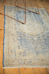 Distressed vintage Oushak runner texture with even wear and faded sky blue, ivory.