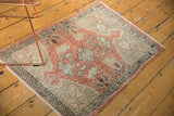 Vintage Distressed Oushak rug corner with pale brick, beige, dark border, and even wear.