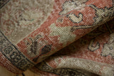Vintage Distressed Oushak rug pile texture with even wear, pale brick and sand tones.