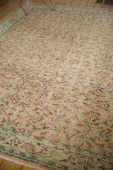 Distressed Oushak rug border and field with faded apricot peach, mint green vinery.