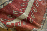 Distressed vintage Oushak runner, rust and ivory tree-of-life pattern with worn texture.