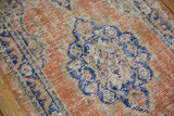 Distressed vintage Oushak runner pile, scalloped motif in pale orange rust, denim blue.