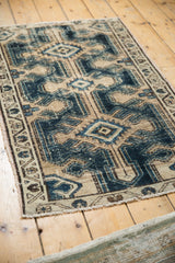 Textured distressed indigo blue and beige patterns of a vintage Northwest Persian rug.