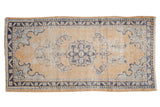 Distressed Oushak rug runner with faded cobalt blue medallion and dusty gold, 2'6