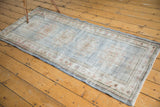 Textured distressed Oushak runner, faded denim blue, slate gray, ivory, and dusty rose.