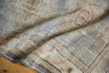 Tightly woven foundation and secured blue-gray edge of the vintage Oushak runner's reverse.