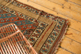 Late 19th century Kurdish rug corner with floral stripes and wide plain camel border.