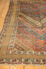 Kurdish rug's floral chevron stripes in madder red, sky blue, with unique wide plain border.