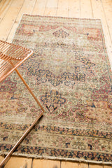 Aged pile and intricate floral design of this traditional Persian Kerman runner.