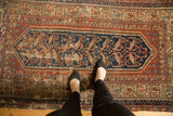 Vintage Hamadan rug, classic serbend border with rust, navy, foundation wear, and tattered edge.