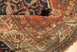 Close-up of Vintage Hamadan rug's serbend border, boteh motifs, rust, navy, tattered edge.