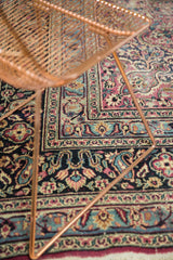 Vintage Persian Meshed carpet with faded plum, blue, ivory floral vinery and border.