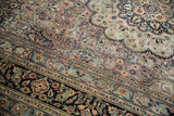 Intricate navy blue border with paisley and floral pale blue border of Meshed carpet.