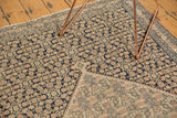 Intricate inverted Herati field and sharp-stepped diamond medallion on an antique Senneh rug.