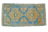 Vintage distressed Oushak rug with faded sky blue and gold double medallion and starbursts, 1'10