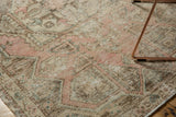 Detailed view of the distressed Oushak rug's texture with soft pink, ivory, and brown tones.