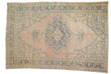 Distressed vintage Oushak carpet with pale dusty pink, denim blue, ivory scalloped medallion. 6' x 8'11