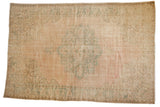 Distressed Oushak carpet, pale dusty pink field, seafoam green medallion, and even wear, 6'11
