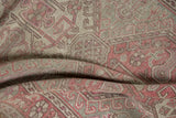 Distressed vintage Anatolian rug with worn pale dusty wine and silver hook and latch motifs.