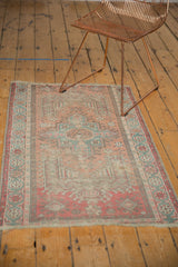 Vintage distressed Anatolian rug, geometric willow motif in apricot peach and oxidized green.
