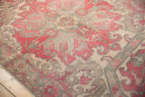 Distressed Oushak rug's worn pile revealing faint foundation, cherry, ivory, and slate motifs.