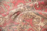 Distressed vintage Oushak carpet detail: worn pile, faint foundation, dusty cherry, beige, and gray.