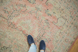 Distressed Oushak rug texture with even wear; muted blush, ivory, and seafoam tones.
