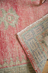 Vintage Oushak runner detail: even wear on pile and multicolor hand-knotted reverse.
