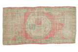 Distressed Oushak runner: octagonal medallion, faded pink, ivory, seafoam green. 2'2