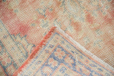 Hand-knotted foundation of vintage Oushak runner, showing side cord selvage and worn pile.