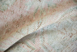Hand-knotted Oushak rug reverse, revealing its woven foundation and soft, distressed colors.