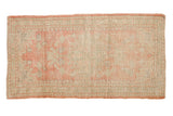 Distressed Oushak runner featuring faded medallion and delicate vinery in soft pink and seafoam tones, 2'3