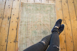 Vintage Distressed Oushak rug runner with visible pile wear and soft seafoam green.