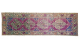 Vintage distressed Oushak runner with repeating purple violet and faded blue medallions, floral border, 3x9.7.