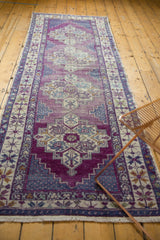 Vintage Oushak runner with brilliant violet purple, stepped contour medallion, showing abrashes.