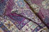 Fantastic abrashes and textured pile of the violet and blue vintage Oushak runner.