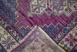 Distressed violet and blue Oushak runner pile, folded to reveal hand-knotted reverse.