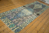 Hand-knotted distressed Oushak runner, pale lavender and faded blue medallions, softened texture.