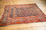 Antique Malayer rug corner detail, highlighting multi-banded tomato red, beige geometric borders.