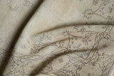 Distressed beige pile texture, vintage Sparta rug with subtle blue patterns.