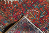 Vintage Karaja rug folded corner, revealing the geometric pile, polychromatic selvage, and woven back.