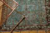 Distressed Malayer runner corner: muted powder blue field with Herati pattern, stepped leaf borders, and fringe.