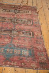 Polychromatic side cord selvage and short, worn pile of a vintage Kazak rug.