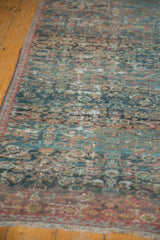 Mahal carpet's intricate Herati motif, with sapphire blue and wine red tones, featuring textured wear to the pile.