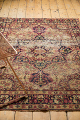 Antique Kerman rug central threadbare stripe with hard tatter.