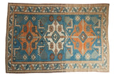 Distressed Oushak carpet with triple Kazak medallions, stylized animals, sky blue, tangerine, ivory.